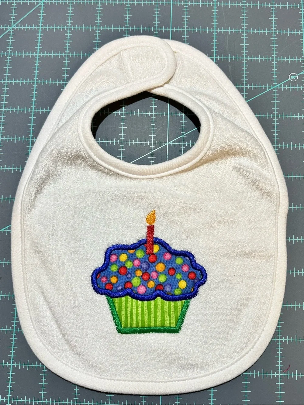 White embroidery appliqué Baby Bib with Colorful Cupcake